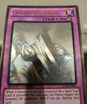 Yugioh Card - Solemn Judgment *Ghost Gold Rare* GLD5-EN045